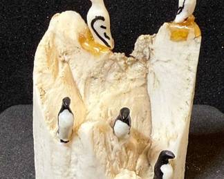 Mike Saclamona Carving Alaskan Birds On A Rock