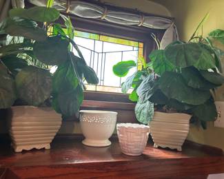 White ceramic planters and faux plants