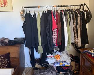 a lot of designer clothing , bags and scarfs