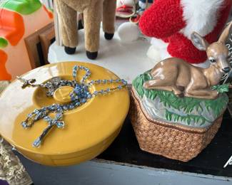 Yellow covered casserole with vintage crystal rosary beads
Deer cookie jar