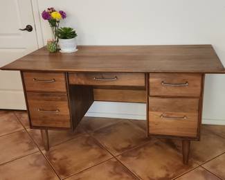 Nice MCM wood desk. Minor, horizontal chip on top left.