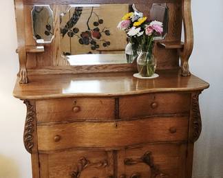 Gorgeous carved wood cabinet with mirror. Dated 1913 on back.