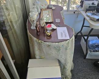 Vintage vanity with floral covering asking $75.