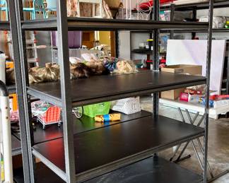 3 black shelving units