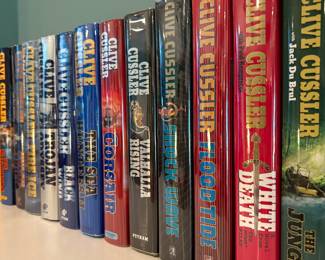 Full set of Clive Cussler including a few first editions and signed copies