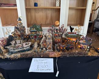 New addition. Dept 56 Halloween Village. Must buy as whole village. Hocus Pocus shop is interactive and tells your fortune. Most prices retired. $300