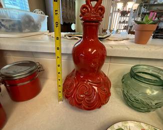 $32~RED DECORATIVE DECANTER