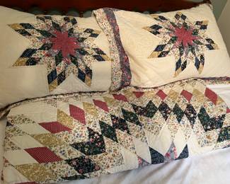 Lone Star-pattern quilt with matching pillows.