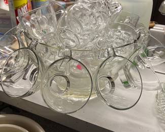 Punch bowl with many extra cups
