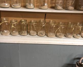 Glass Jars with sand, candle and ribbon