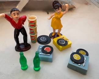 Dancers with coca-cola bottles and Pepsi cups