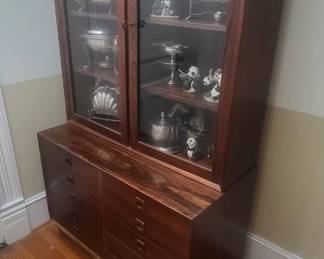 Danish Modern Cabinet with glass doors and multiple drawers. Brazilian Rosewood