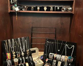 Ample selection of jewelry including earrings, necklaces, bracelets, watches, sunglasses, and other accessories. 