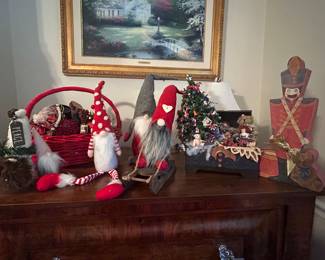 A lot of Christmas decor and decorations from tabletop, to ornaments, Christmas trees, and music boxes.  There is wrapping paper, seasonal boxes, and wreaths.   