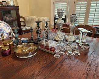 Collection of candle holders, votives, candles.   There will be a few vintage oil lamps available as well.  
