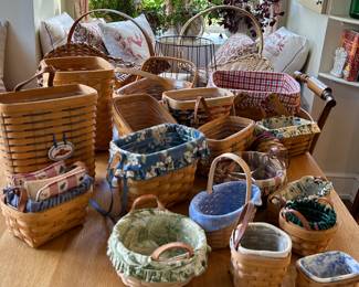 A variety of baskets and styles.  Many are Longaberger of which there are a few collector baskets.  