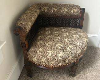 Vintage pouting chair with exceptionally detailed wood trim in great condition.   