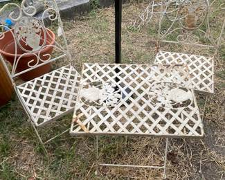 Child’s ornate metal table and chairs