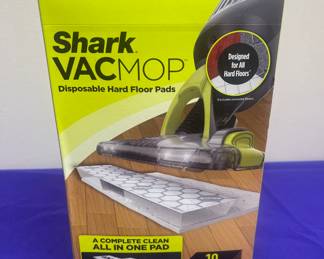 Large assortment of cleaning supplies, including shark vac