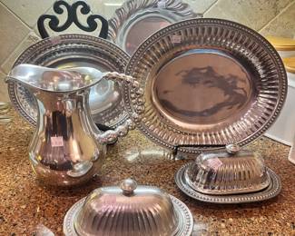 Wilton Armetale platters, butter dishes, and pitcher
