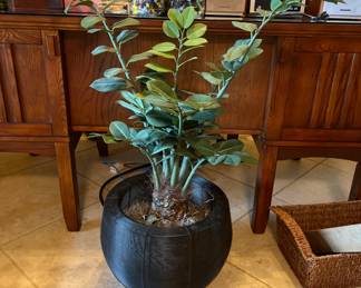 Artificial plant in metal basket
