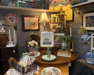 Lots of framed art, bird cage, candlesticks