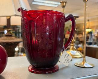 Depression Glass Cherry Blossom Pitcher and vintage brass candlesticks. 