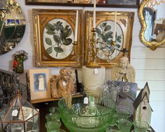 Botanical prints, gold mirror, angel, small birdhouse. 