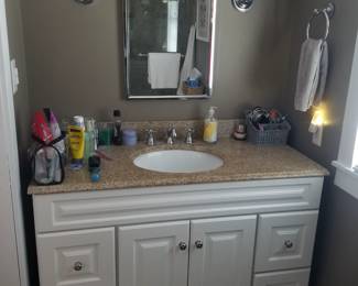 Updated bath vanity; vanity mirror; vanity lights