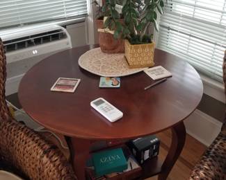 Round foyer table with shelf