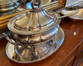 Sheffield English soup tureen resting on a reed and Barton silver plate tray