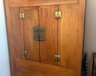 Solid wood, brass lock, and hinges. Deep storage with upper shelves