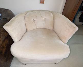 Vintage Cream-Colored Chair on Wheels. 