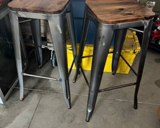 Pair of stackable industrial barstools.