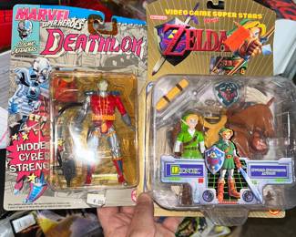 Both in their original Blister pack - on the right - Legend of Zelda: Ocarina of Time Link. On the left - Marvel Deathlok.