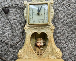 United Clock Co. - Animated Swinging Boy & Girl Lighted Mantel Clock.