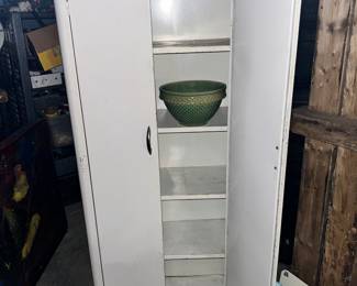 Multi shelf two door pantry organizer.  LOOK &#128064;  inside and you’ll see the 1920s McCoy 10 “ diameter checkerboard waffle pattern mixing bowl.