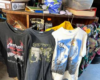 From left to right T shirts of Metallica, God Smack, Garth, and a Sun Force button down Hawaiian shirt.