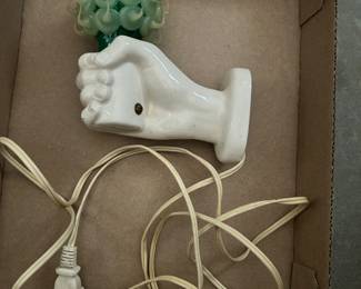 N. (Nancy) Funk human hand, ceramic wall light.  Circa 1940s thru 50s.