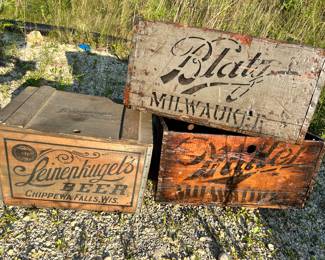 Hi hinged Leinenkugel’s  beer crate on the left. On the top right is a Blatz and below is a Miller beer wood crate.