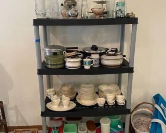 Tupperware bottom shelf and vintage pots on second shelf