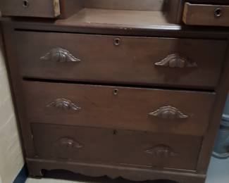 An antique dresser in good condition