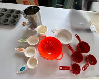 Flour sifter,  small plastic colander,  measuring cups.   $5 for entire lot.