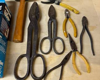 Tin snips,  pliers rubber mallet- $15 for all. 