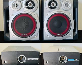 Aiwa SX-NR30 speakers, a vintage Sawyer's Rotomatic 700 slide projector, and a Sawyer's Rotomatic Slide Projector. 