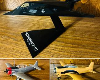 Vintage airplane models including a Lockheed F-117 Nighthawk stealth attack aircraft, North American T-6 Texan and a RC model airplane