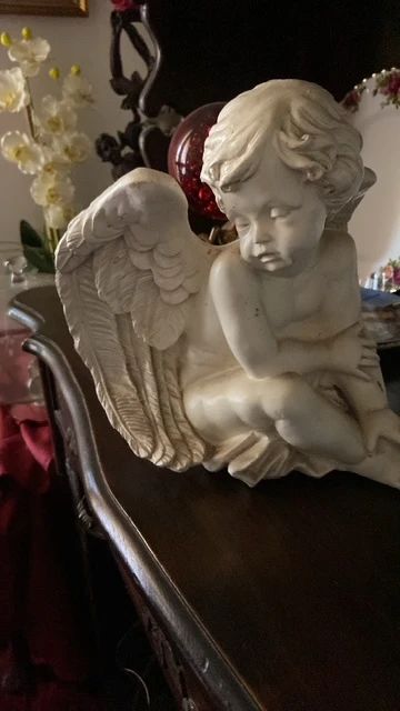 Charming cherub statue 