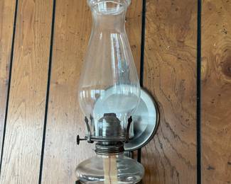 Wall mounted kerosene oil lamp. 