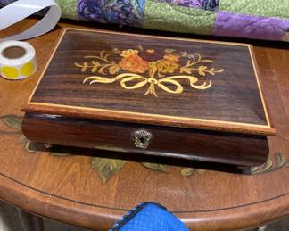 Jewelry box and handmade quilt. 