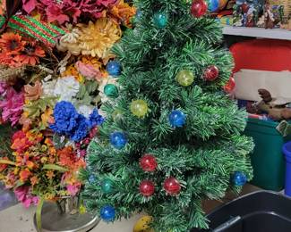 Rotating musical Christmas tree, huge amount of floral and wreaths